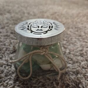 Decorative Glass Jar Of Sea Glass And Shells with Silver Buddha Lid